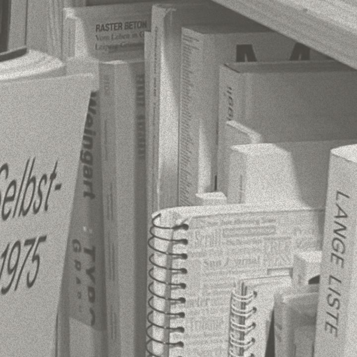 A close view of book spines on a shelf